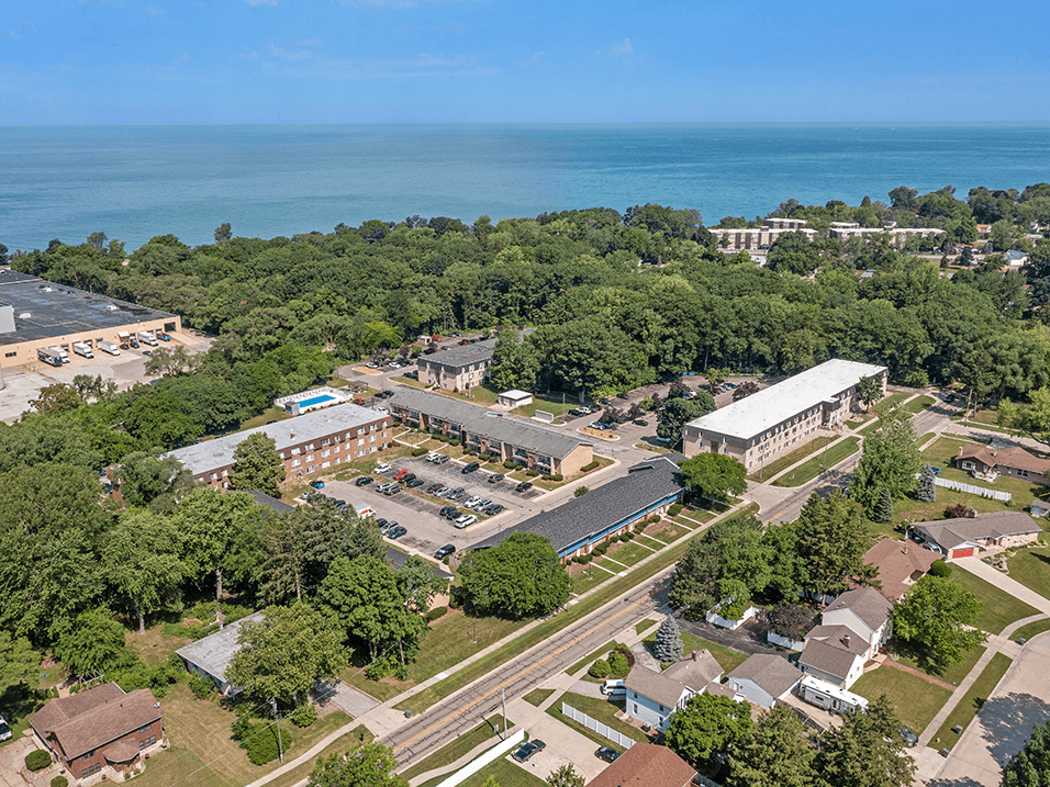 an aerial view of the campus with lake Michigan in the background