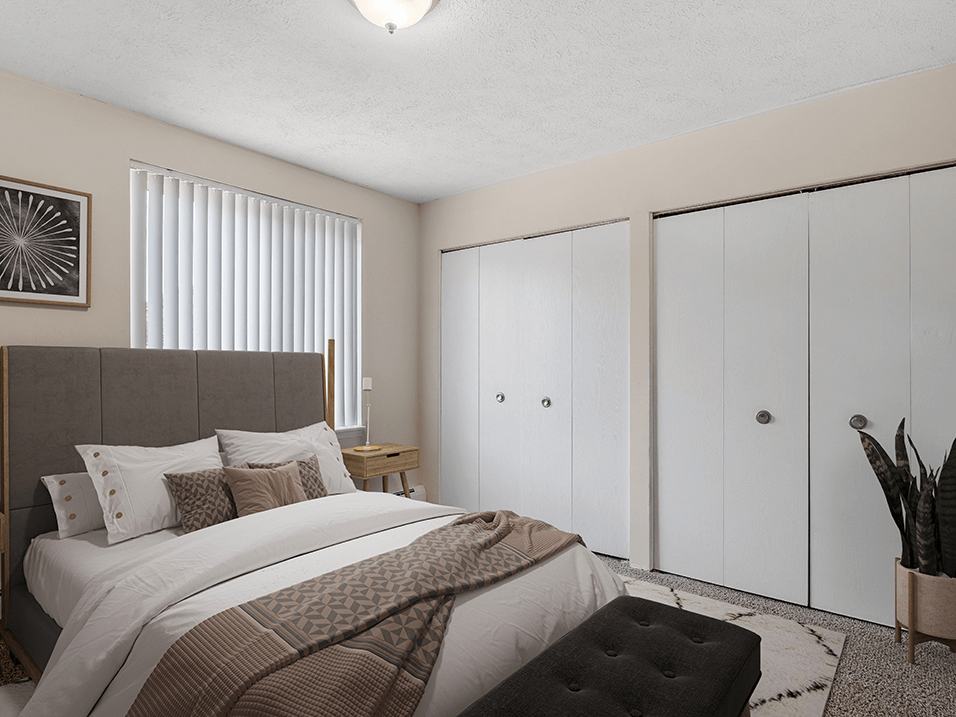 a bedroom with a bed and a closet