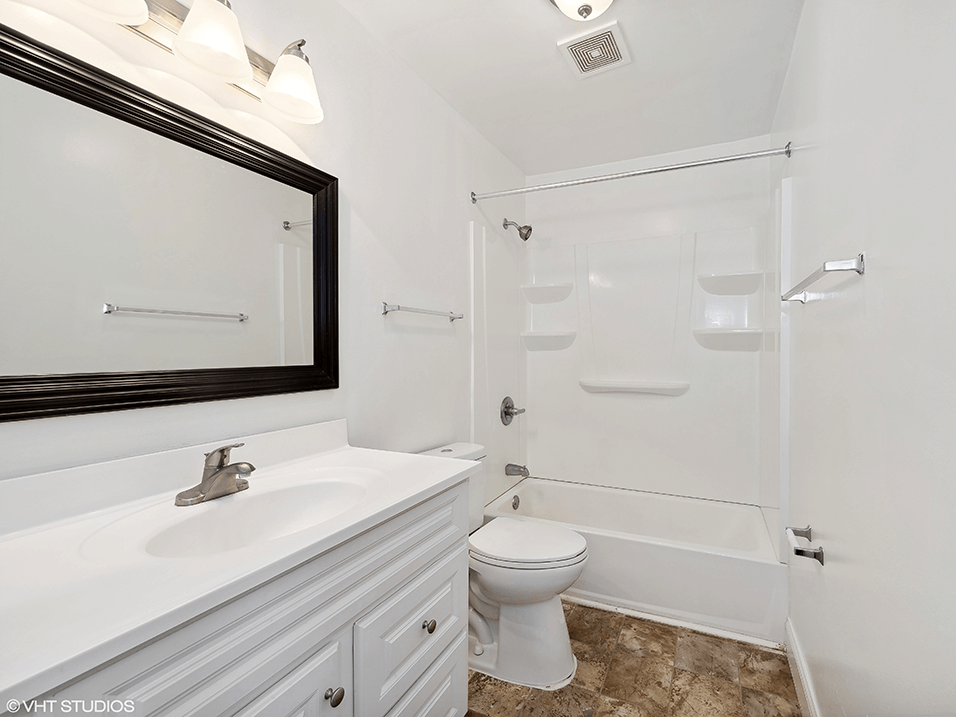 modern apartment bathroom with a shower tub