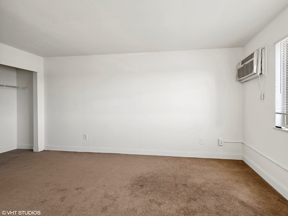 an empty room with Air Conditioning on the wall