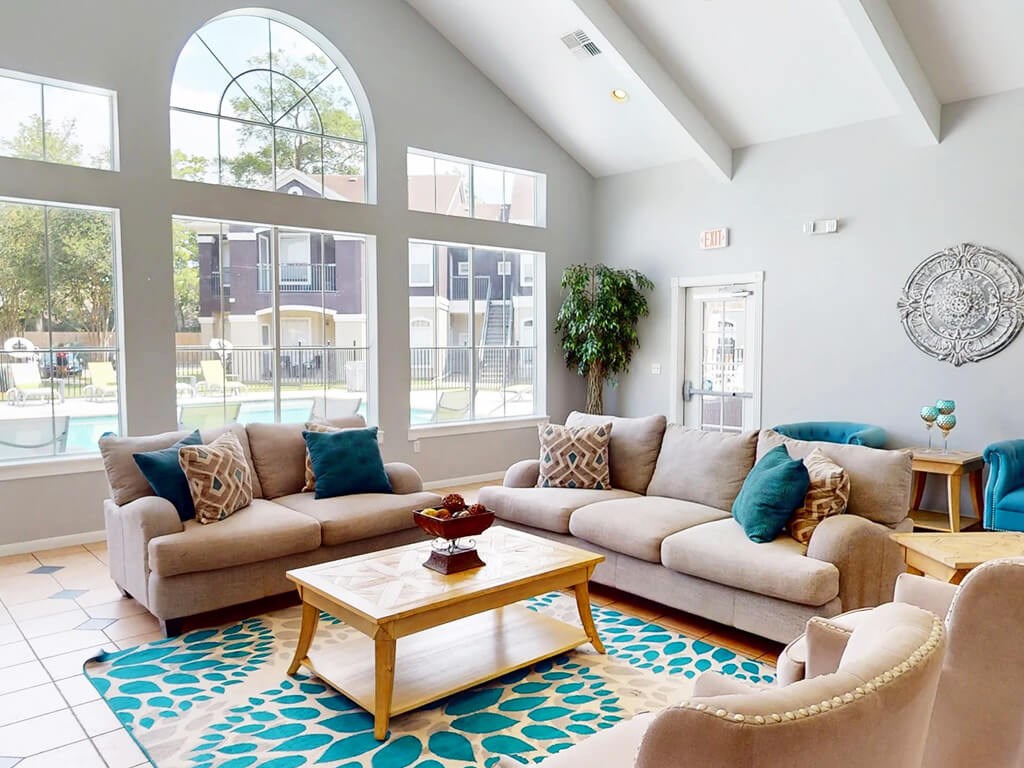 A living room with a large couch and a coffee table.