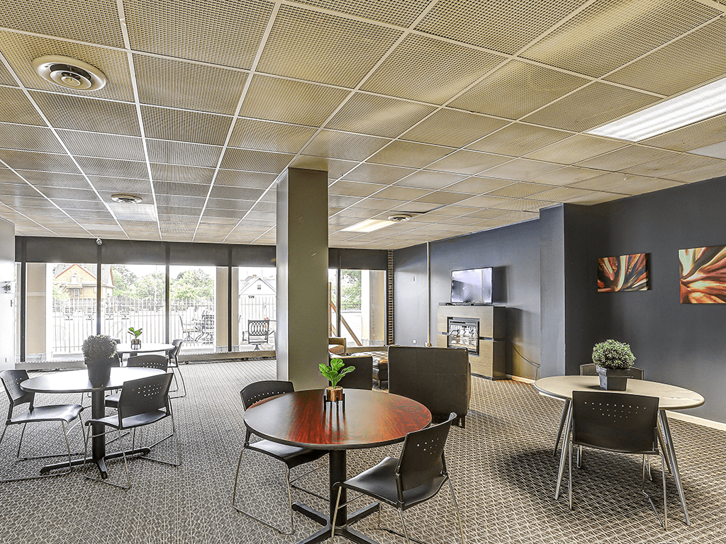 A conference room with a table and chairs.