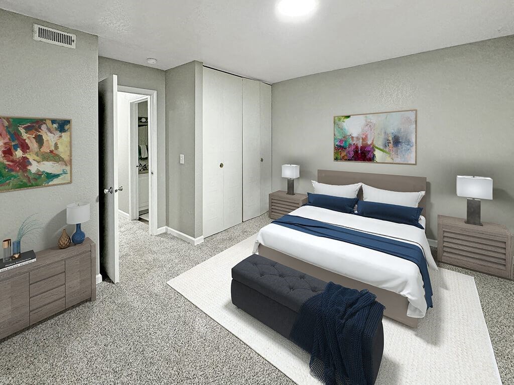 A bedroom with a bed, nightstands, and a painting on the wall.