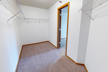 Large walk-in closet at meadows of coon rapids.