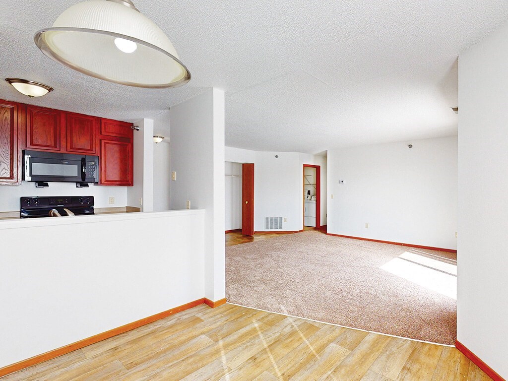 A living room with a television and a microwave.