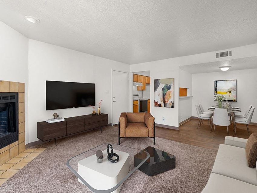 a living room with a fireplace and a flat screen tv - Photo Gallery