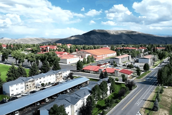A mountain is in the background of a town.