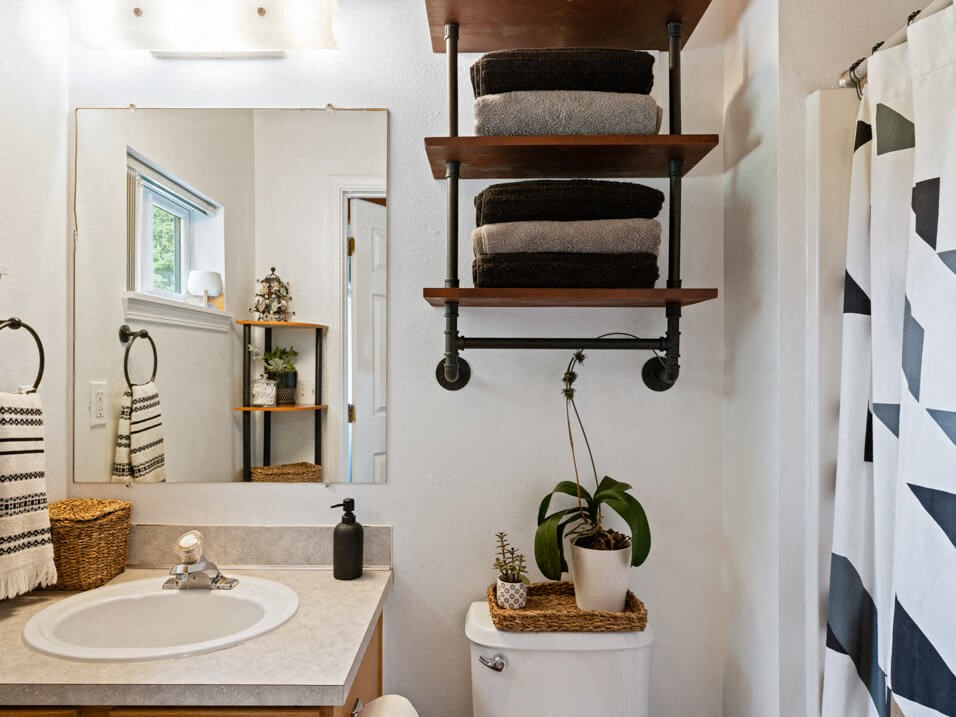 full bathroom with under the sink storage at mountaineer village apartments