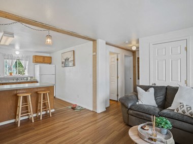 Living area with breakfast bar and hardwood floors