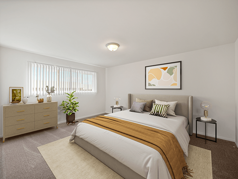 Bedroom with large window at miller west apartments