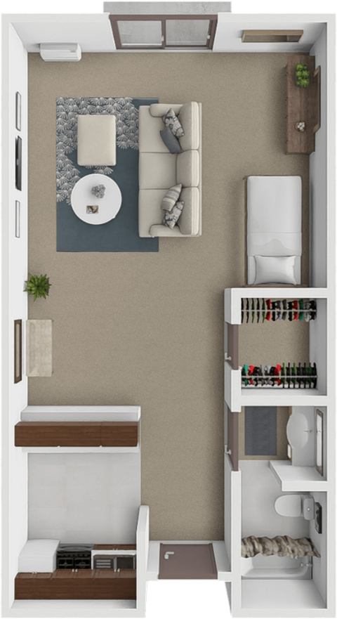 A small apartment with a bed, a couch, a table, and a shelf with various items.