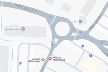 A map shows a USPS drop box located on a street corner.