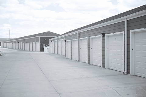 A long row of garage doors are closed.