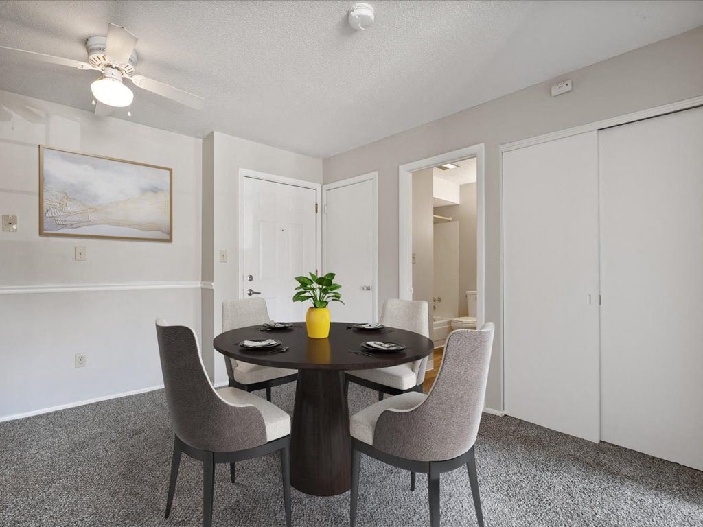 our apartments offer a dining room with a table and chairs