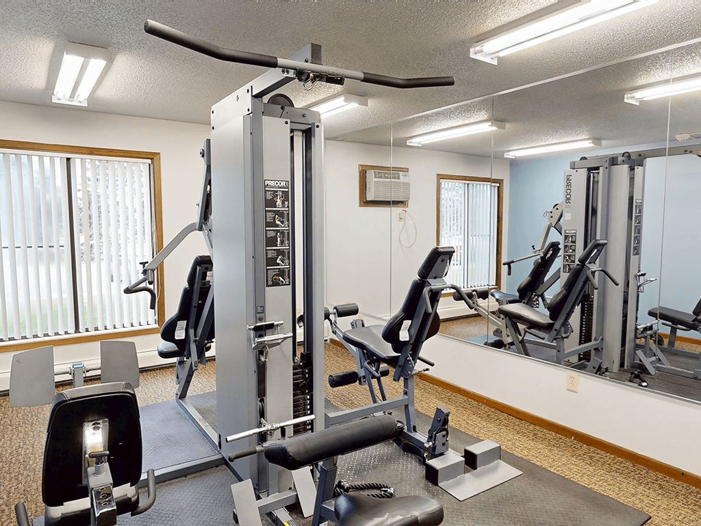 A well-equipped gym with a variety of machines and weightlifting equipment.