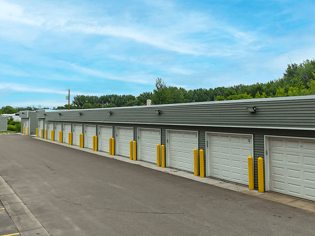 A long row of garage doors are closed.