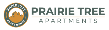 The image is a logo for Prairie Tree Apartments.