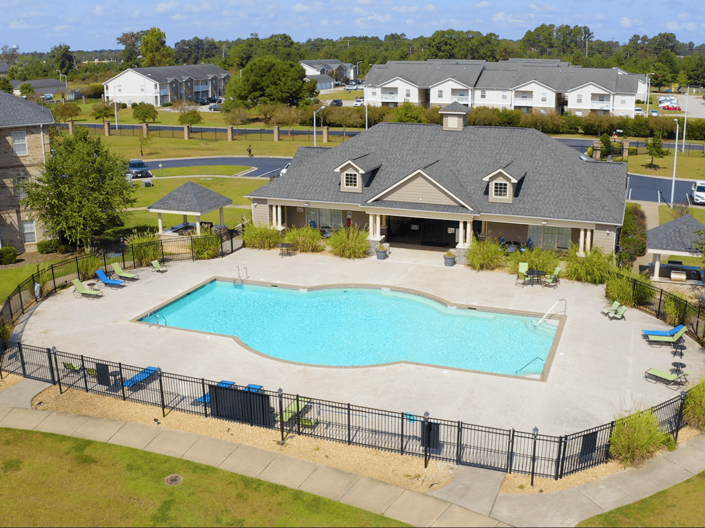 A large house with a pool in the backyard.