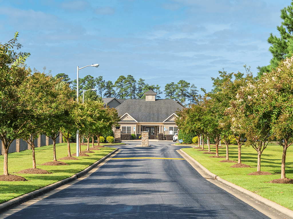 A long street with a house at the end.