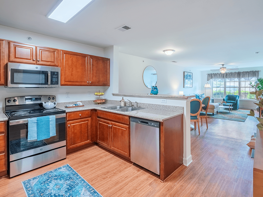 A kitchen with wooden cabinets and stainless steel appliances.