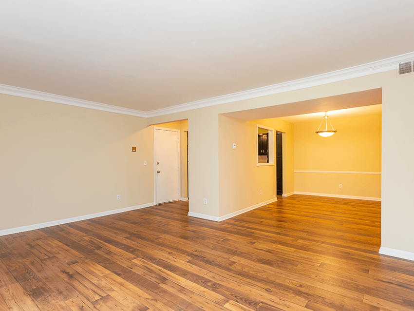 Large living room with wood-style flooring at preserve at woodland - Photo Gallery