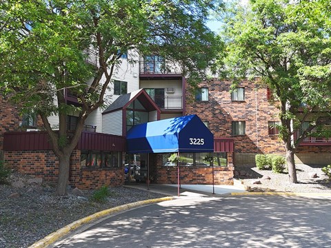 A building with a blue awning and the number 3225 on it.