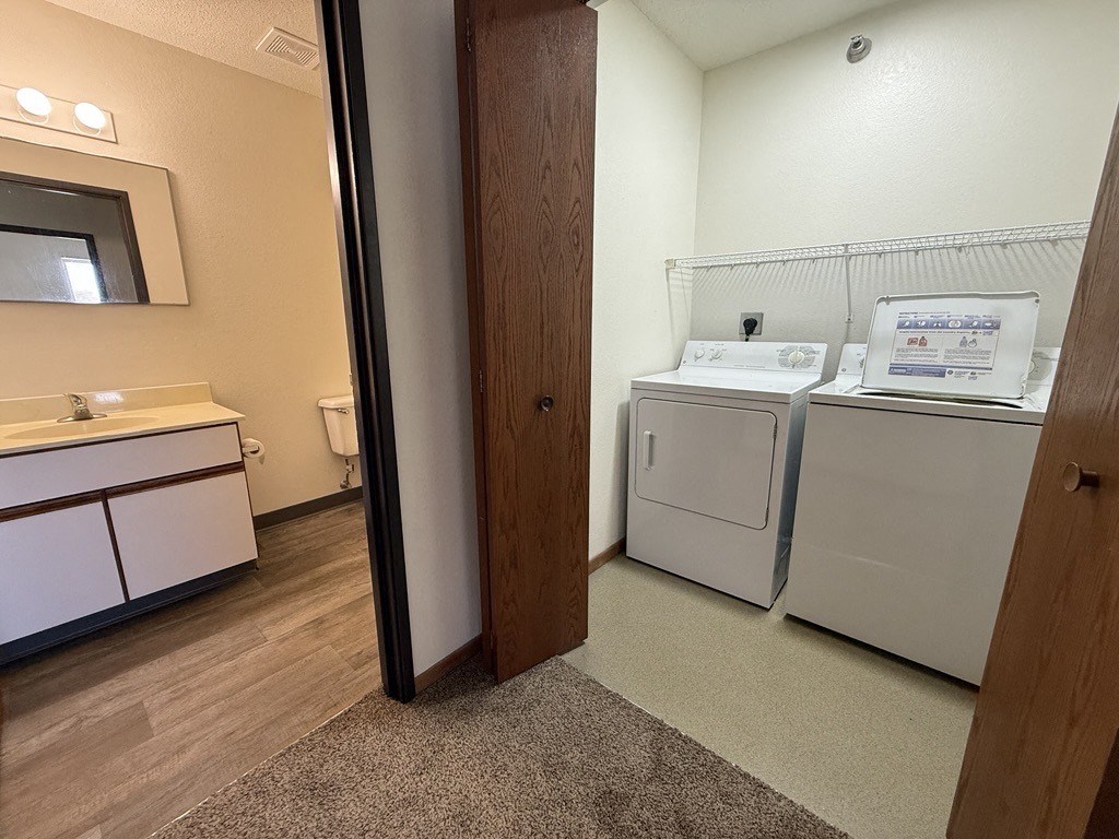 A laundry room with a washer and dryer.