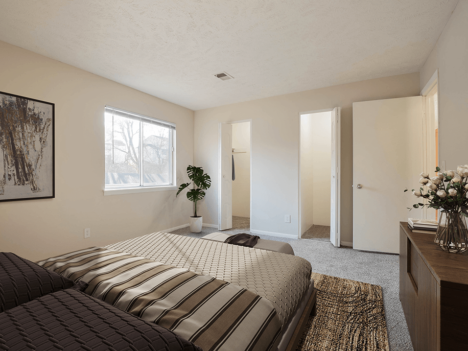 a bedroom with a large bed and walk-in closet