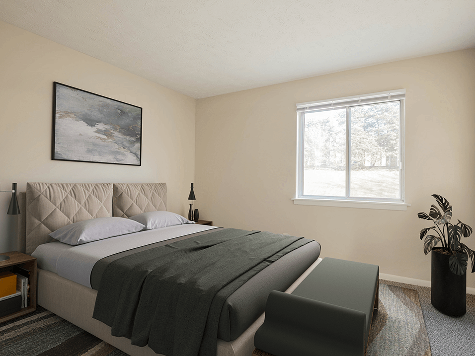 a bedroom with a large bed and a large window