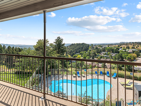 A pool with a view of the mountains.