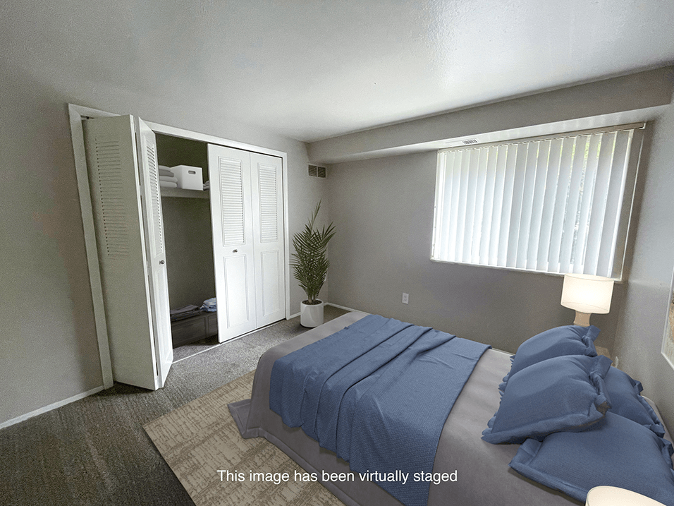 a bedroom with a bed and a closet