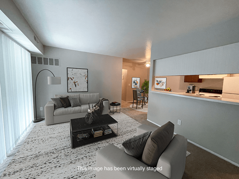 a living room with a couch and a table