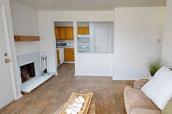 A living room with a fireplace and a couch.