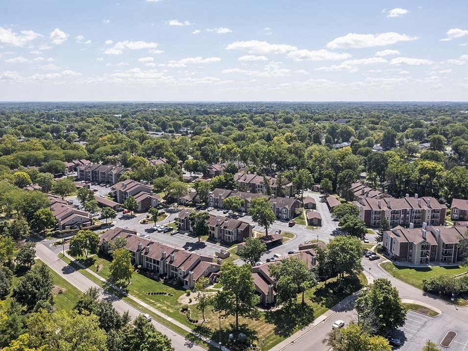 an aerial view of a neighborhood with houses and trees