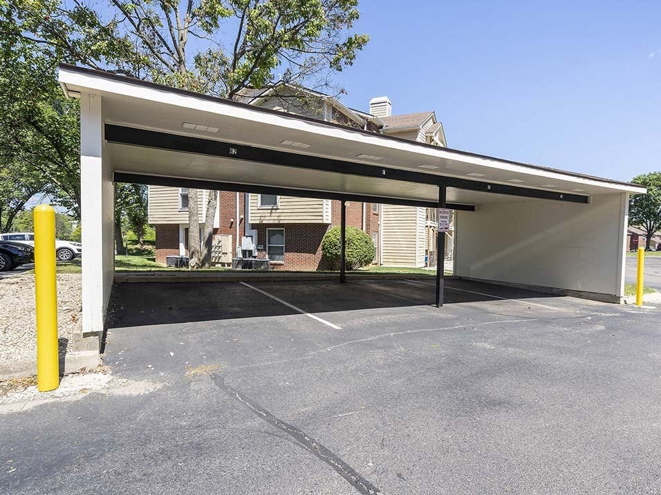 a parking garage in front of a brick building