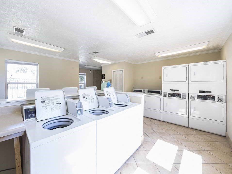 a kitchen with lots of white appliances and counters