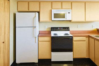 apartment kitchen with refrigerator