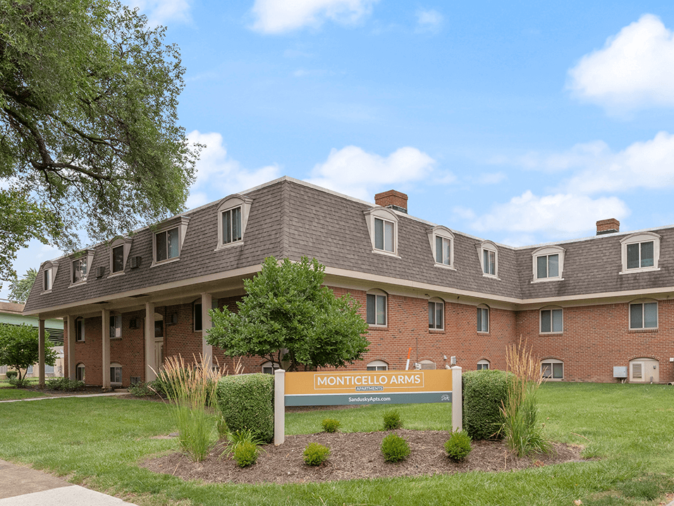 welcome sign for Monticello Arms Apartments