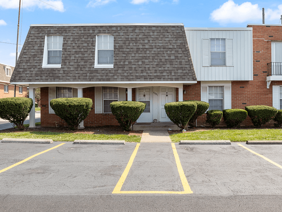 a brick apartment building with Off Street Parking