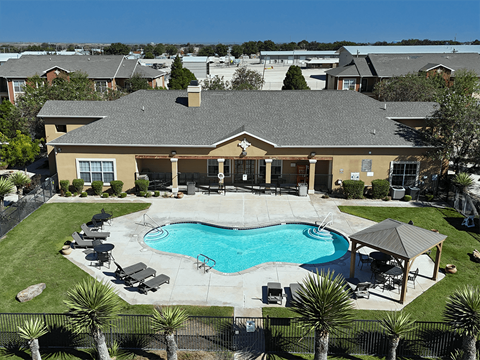 A large house with a pool in the backyard.
