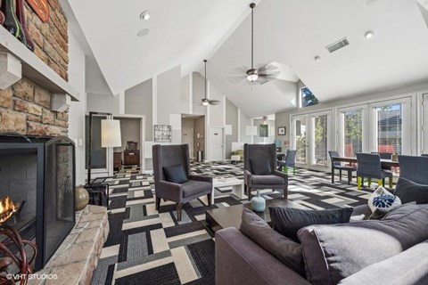 a living room filled with furniture and a fireplace
