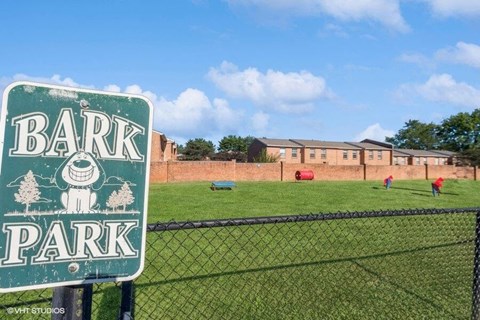 a bark park sign in apartment complex