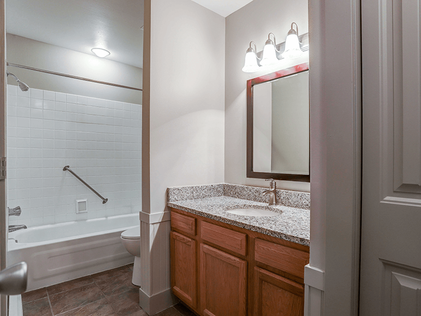 a bathroom with a bathtub and a sink - Photo Gallery