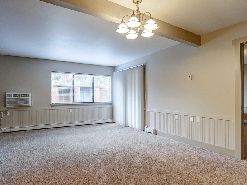 a bedroom with a large window and a chandelier - Photo Gallery