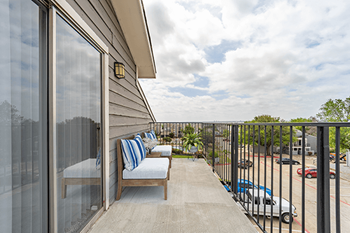 take in the view from the balcony at the Summit on the Lake Apartments