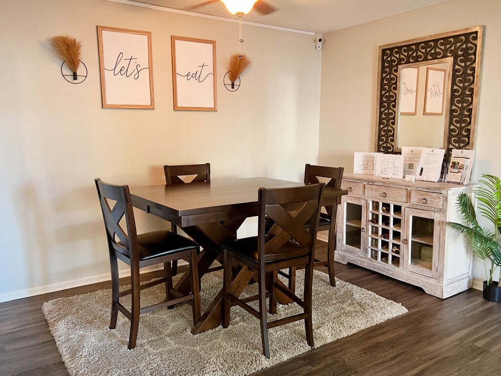 apartment dining room with a table and chairs