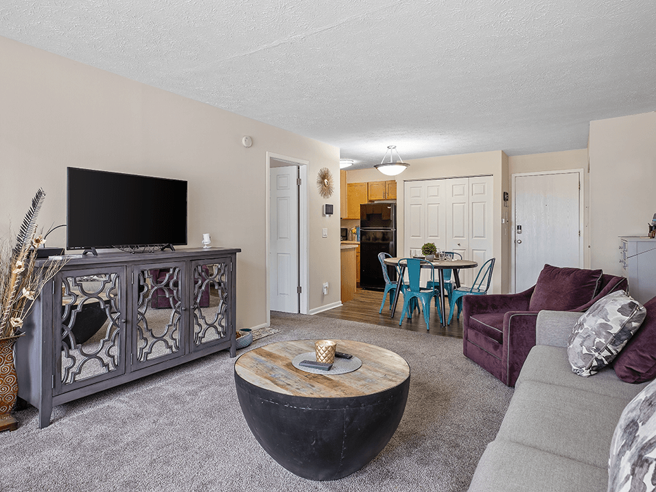 a living room with a couch a chair and a coffee table