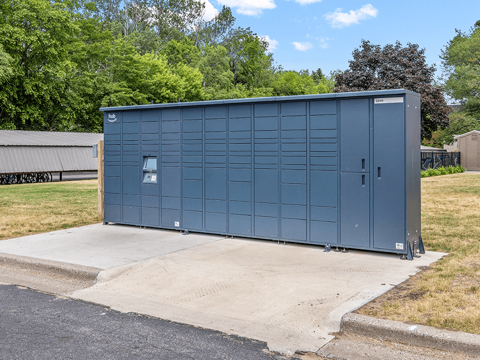a small metal building with a door on the side of it