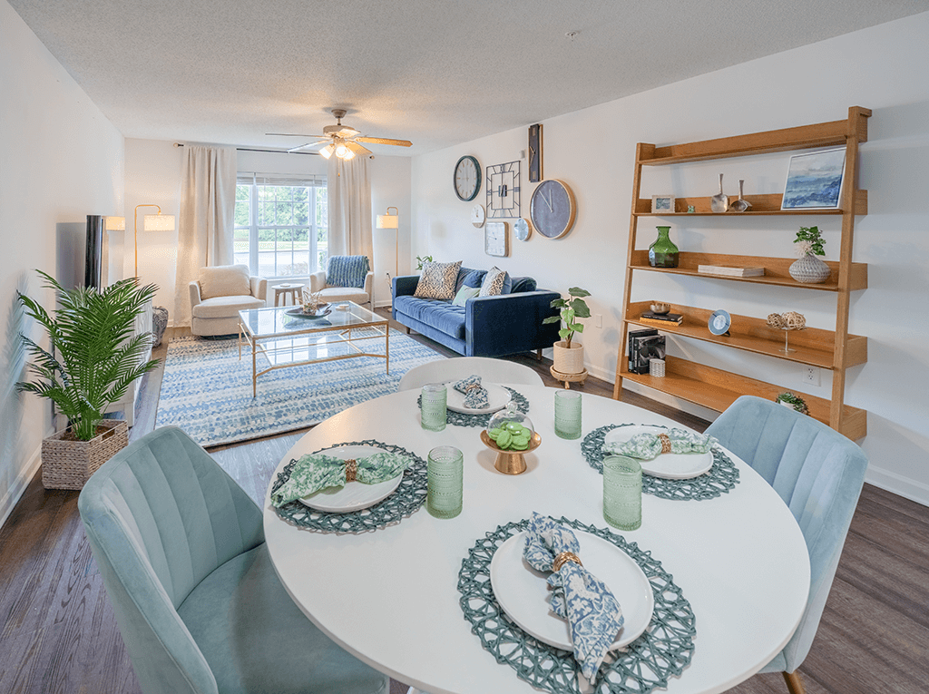 A dining room with a white table set for six.