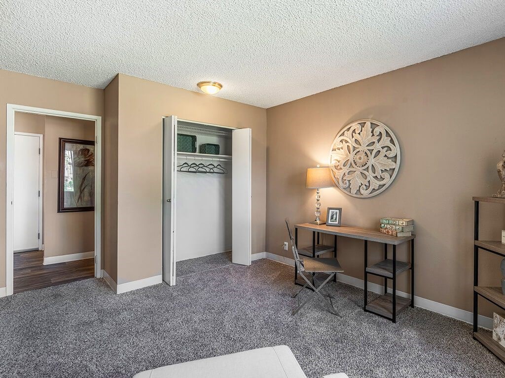 A room with a desk and a chair.